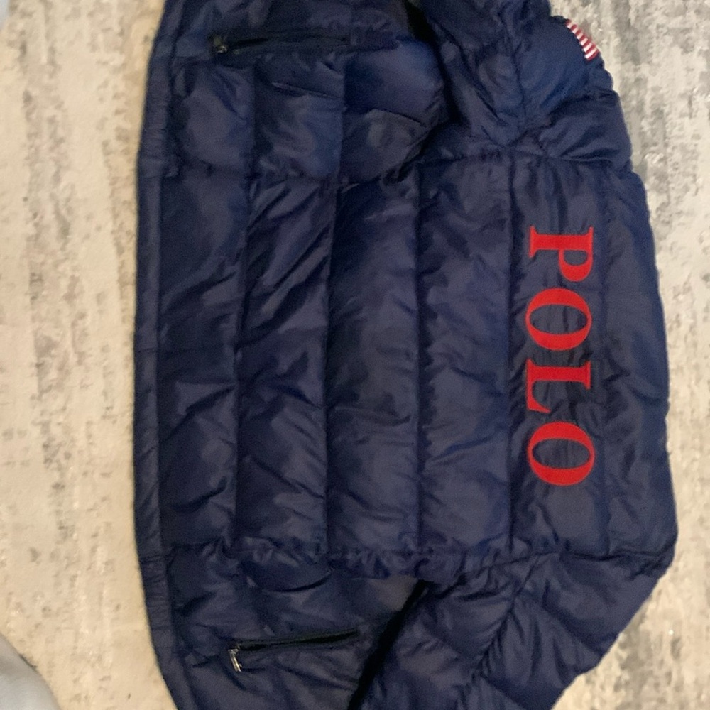 A blue and red used polo jacket for kids